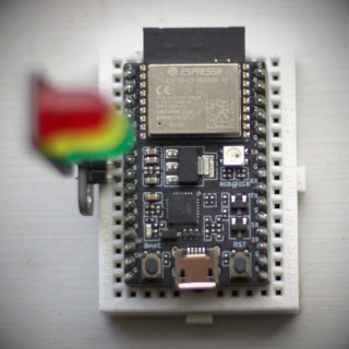 ESP32-C3 microcontroller with LED module attached
